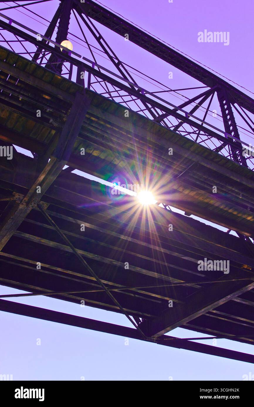 A modern steel structure, the rebuilt Traffic Bridge spans the South Saskatchewan River, reconnecting downtown Saskatoon with the east side. Stock Photo