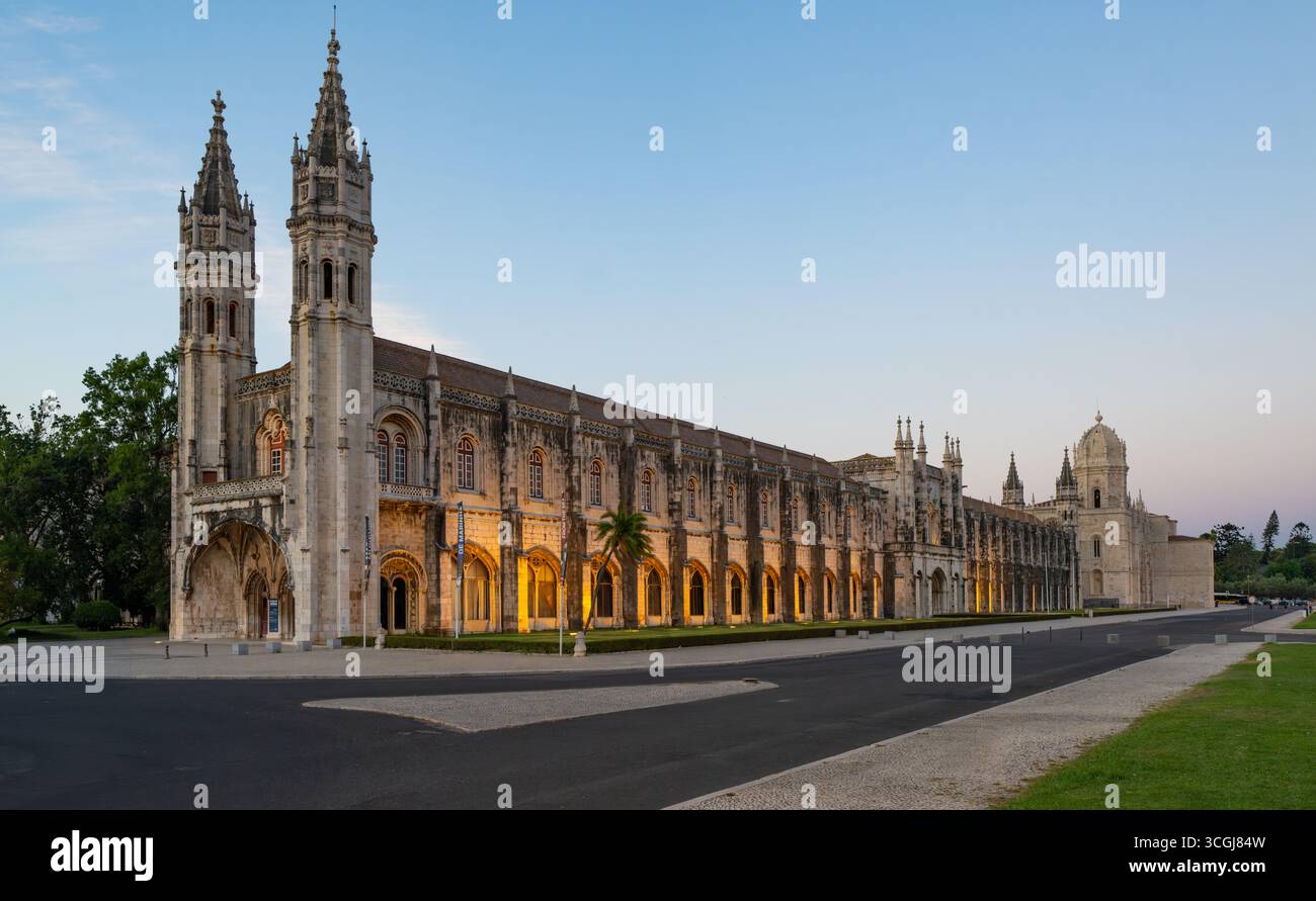 Jerónimos Monastery illuminated at dusk, Belém, Lisbon - UNESCO World Heritage Manueline architecture masterpiece, Portugal Stock Photo