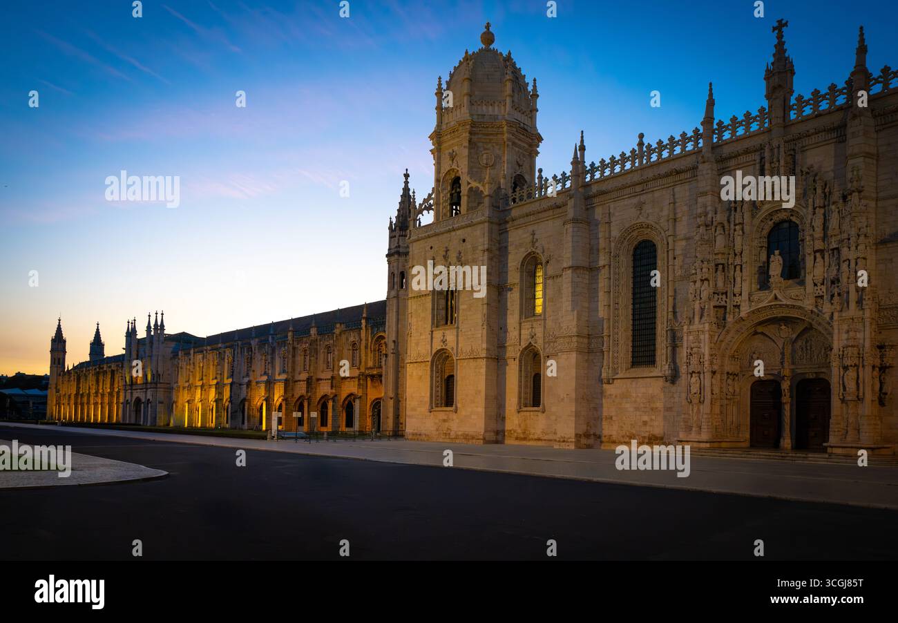 Jerónimos Monastery illuminated at dusk, Belém, Lisbon - UNESCO World Heritage Manueline architecture masterpiece, Portugal Stock Photo