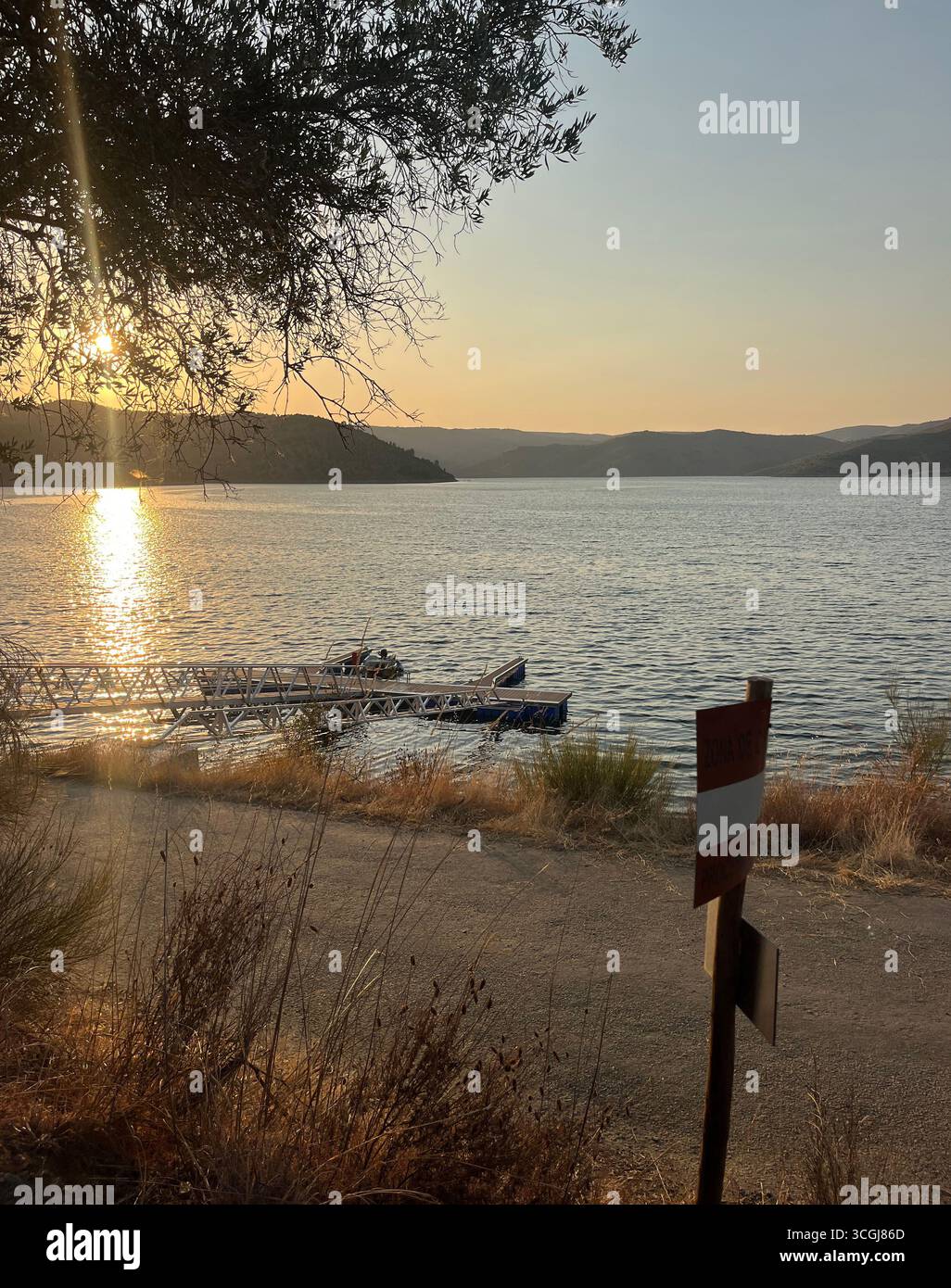 boat pontoon sunset over the River Sabor near Felgar, Torre de Moncorvo, Portugal. - Smartphone Captured Stock Image boat pontoon sunset over the River Sabor near Felgar, Torre de Moncorvo, Portugal. - Smartphone Captured Stock Image