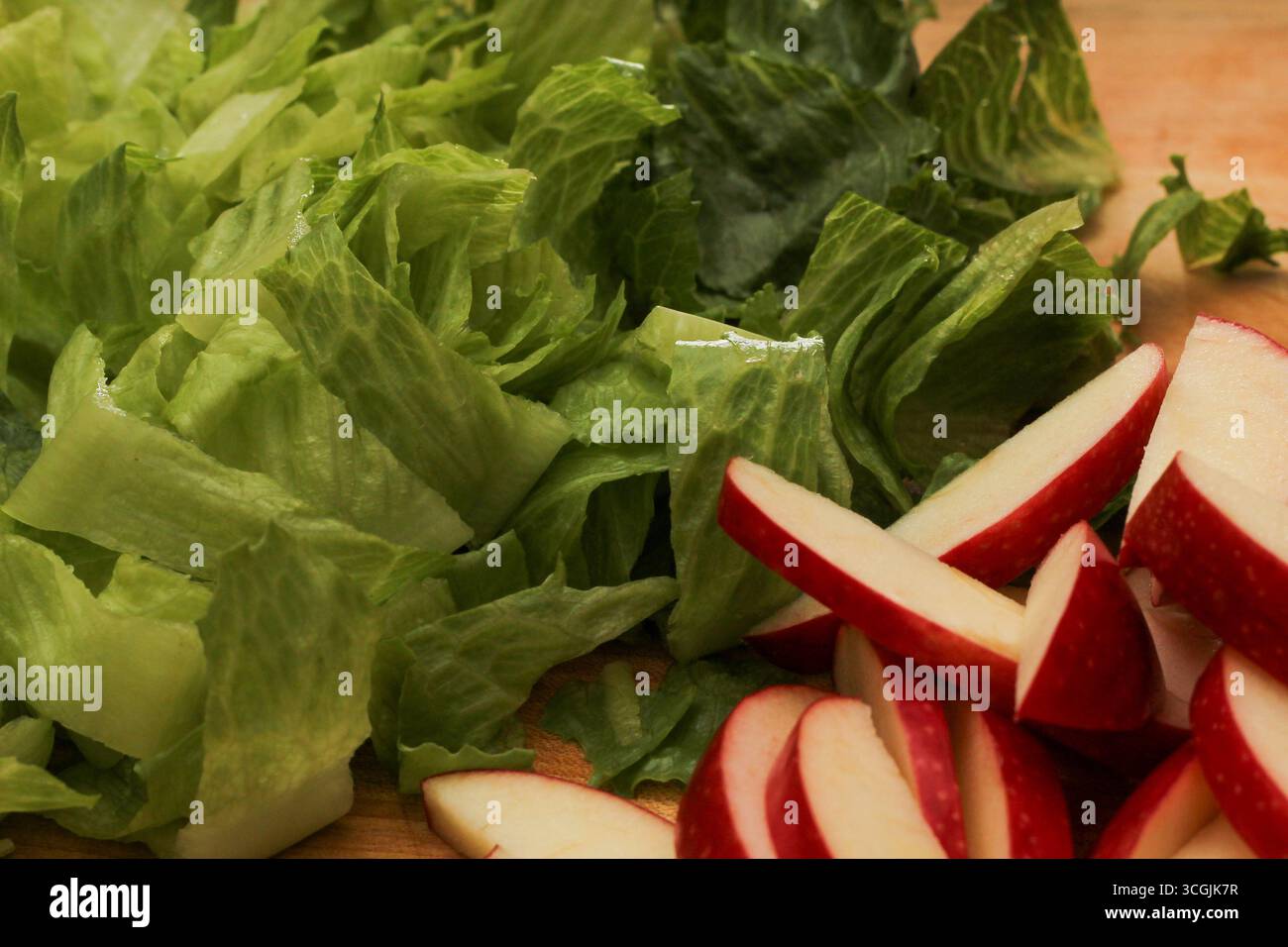 Sliced Apples and Romaine Lettuce Salad Ingredients Stock Photo