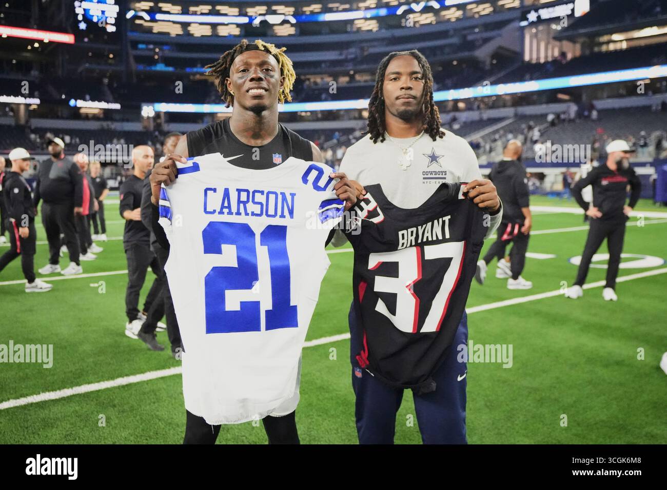 Atlanta Falcons cornerback Cobee Bryant, left, swaps jerseys with ...