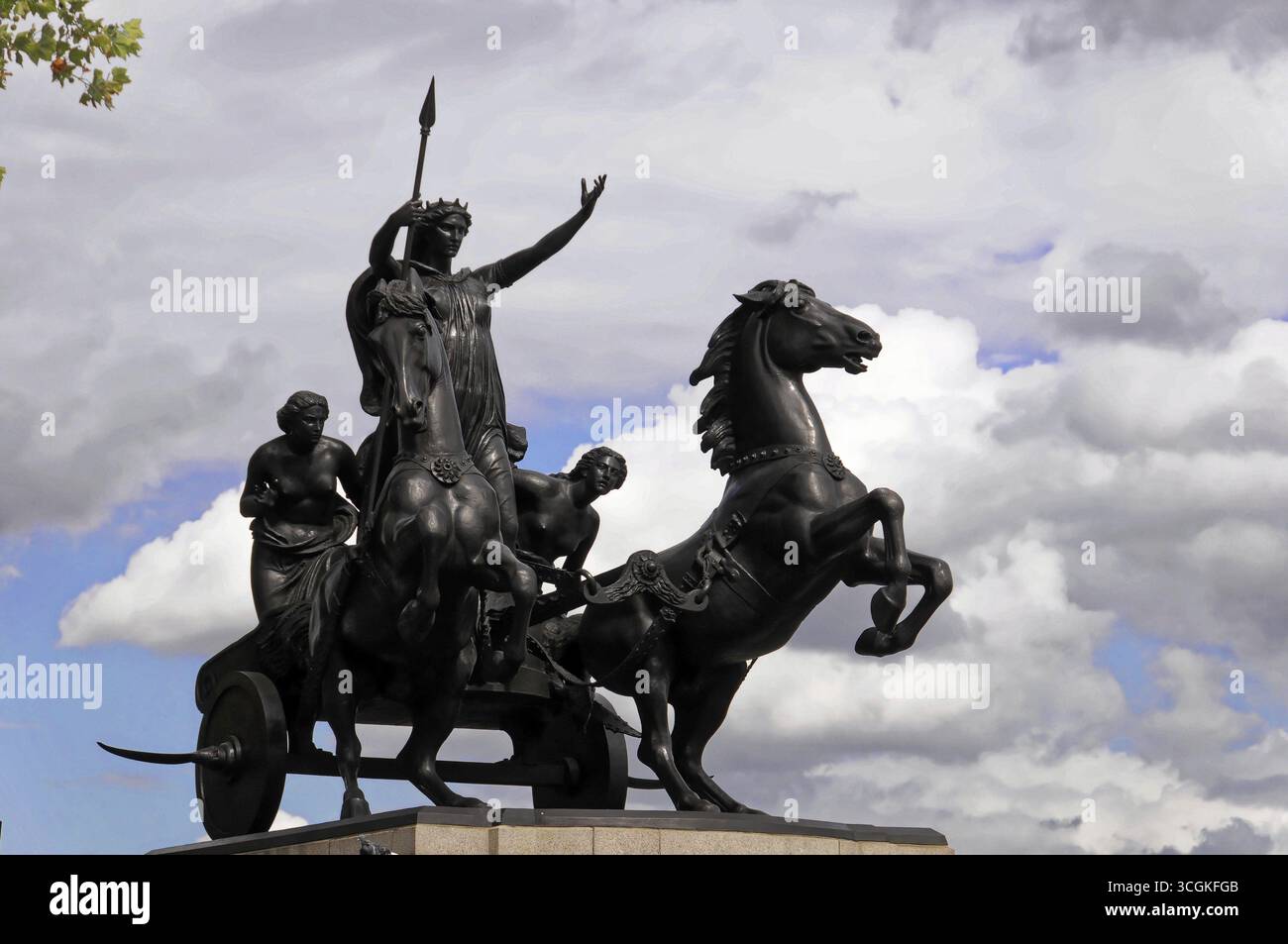 Dramatic statue of Boudicca on a chariot under a cloudy sky, London ...