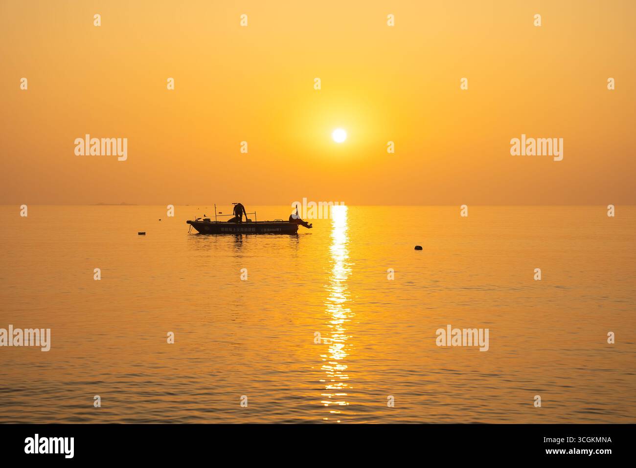 Boat floats peacefully on ocean hi-res stock photography and images - Alamy