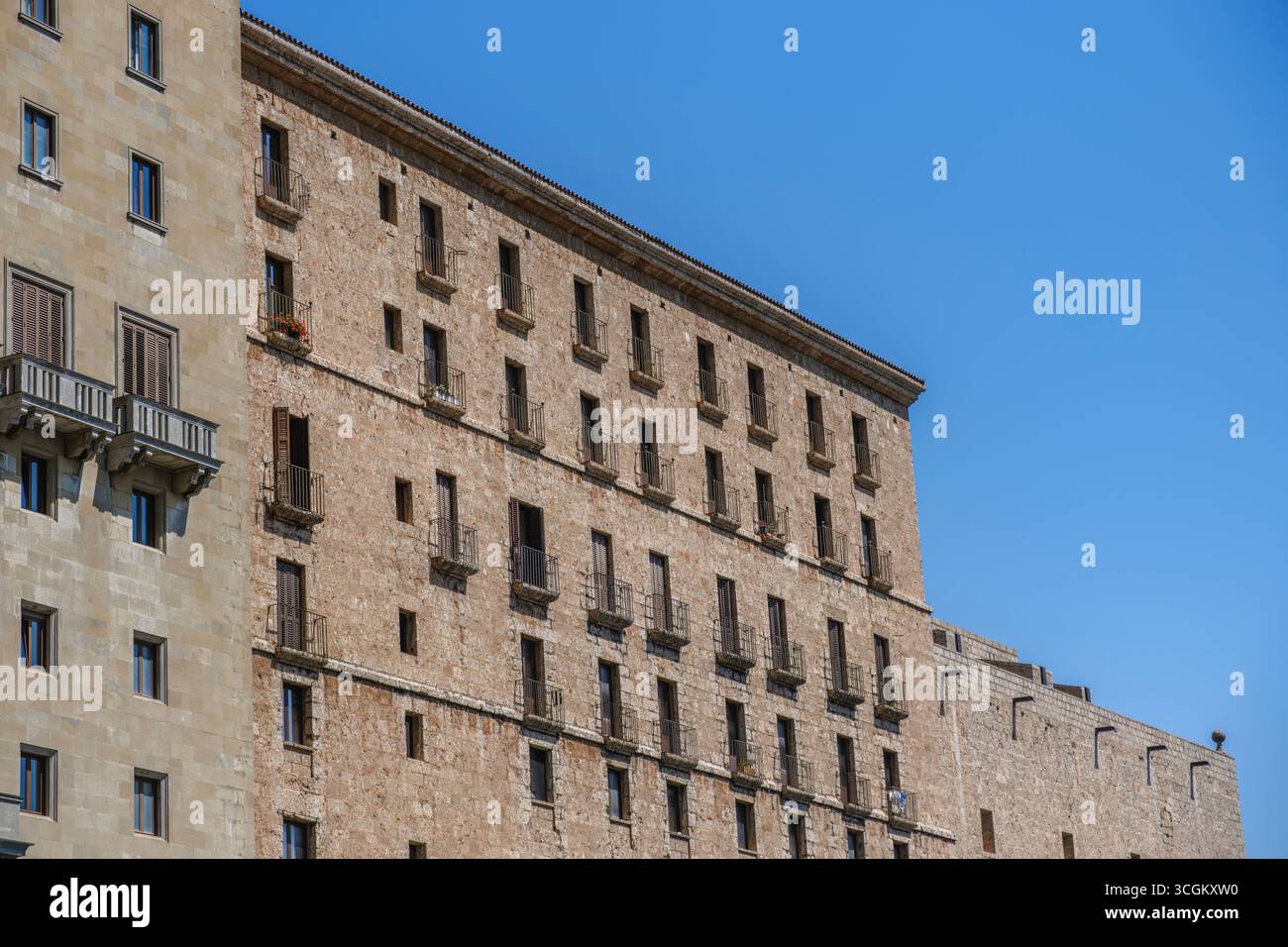 Historic Stone Building With Traditional Balconies In Montserrat Monastery Complex. Medieval, Religious Heritage, Catalonian Mountain Monastery Stock Photo