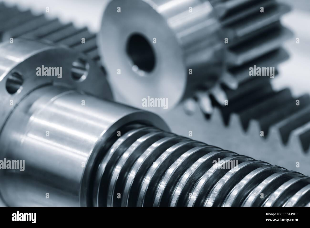 Screw In Shaft Close up of industrial metal screw shaft as part of screw transmission ...