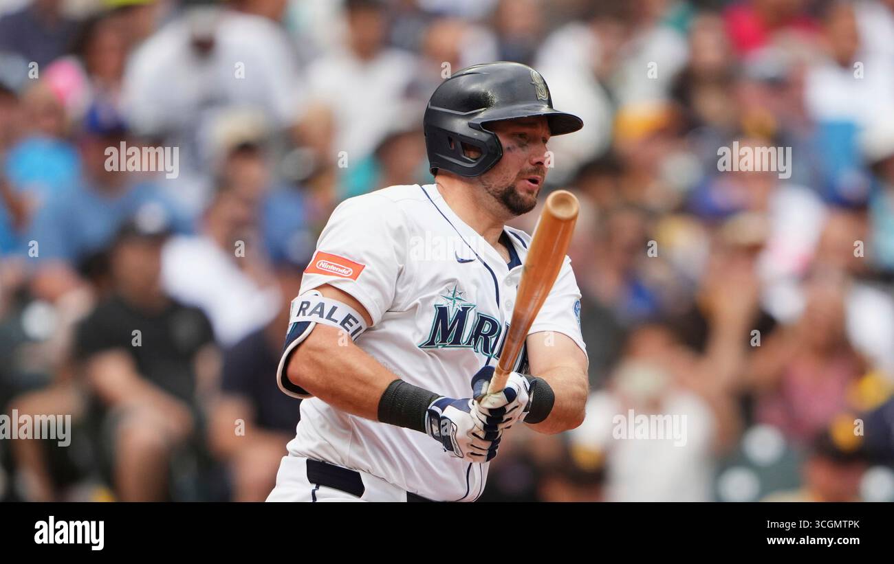 Seattle Mariners' Cal Raleigh follows through during an at-bat against ...