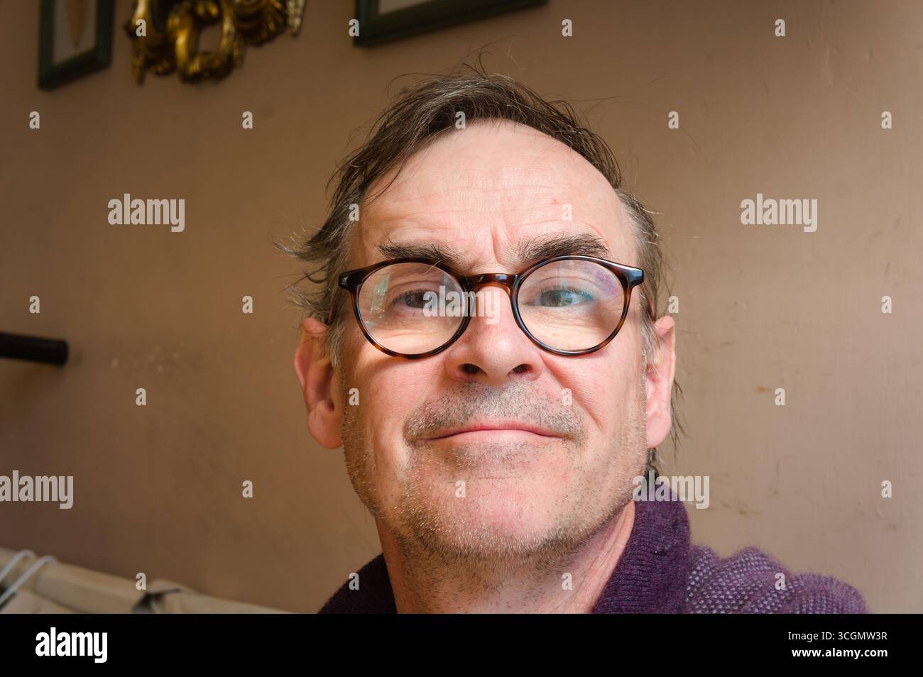 senior man wearing spectacles smiling Stock Photo