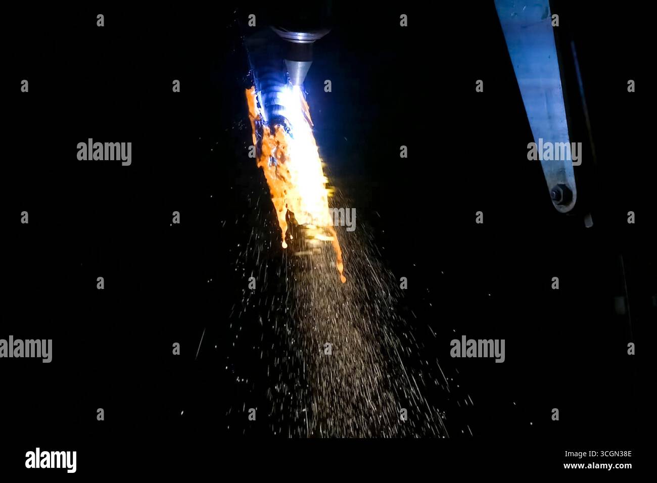Metal splashes from laser welding, part destruction Stock Photo - Alamy