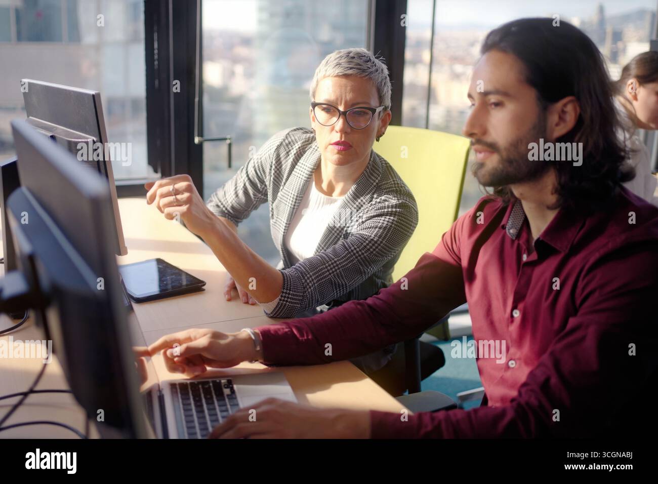 Business colleagues collaborating in modern office Stock Photo