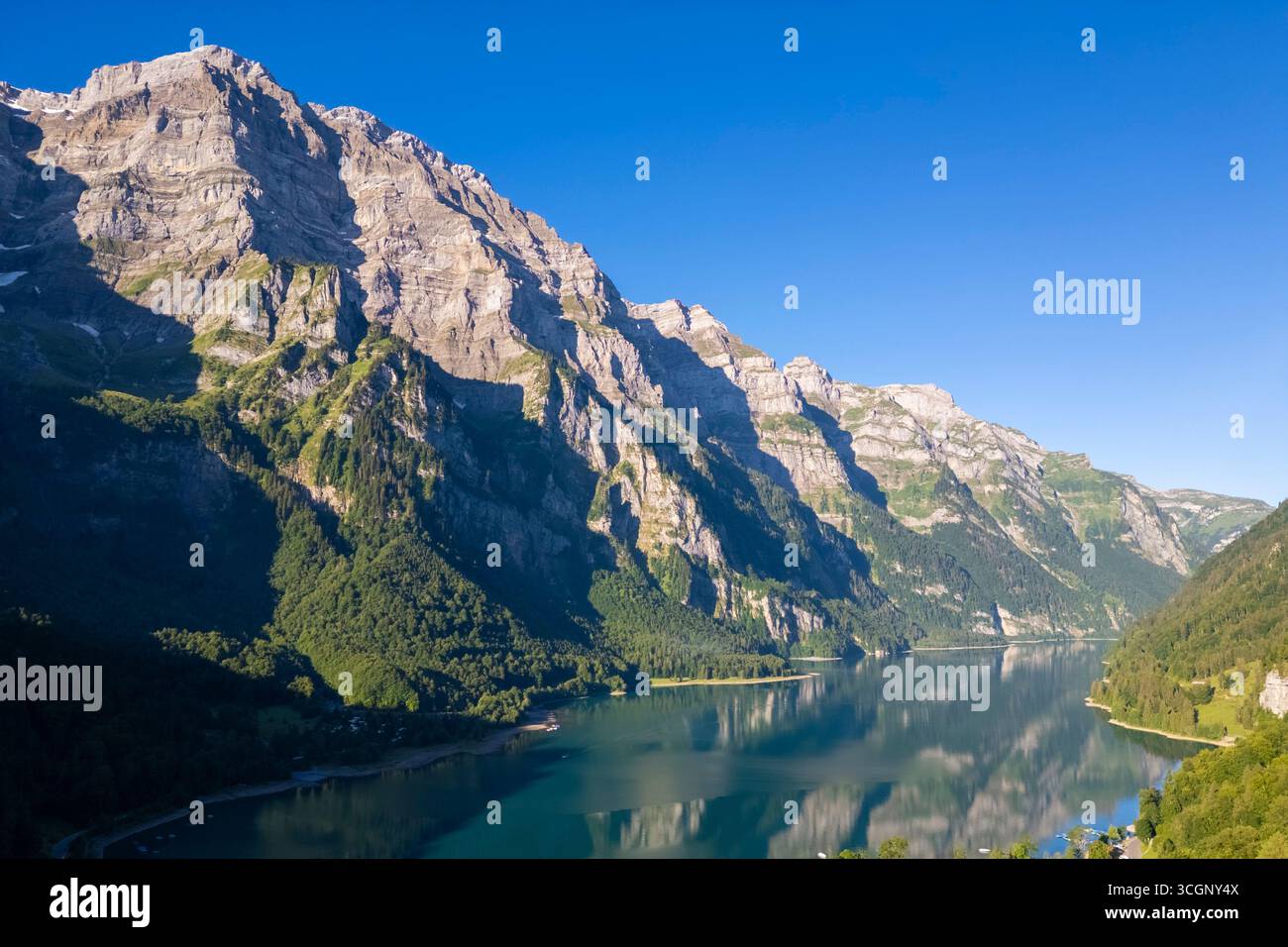 Aerial view of Klöntalersee lake at sunrise in summer. Glarus,  Canton of  Glarus, Switzerland. Stock Photo