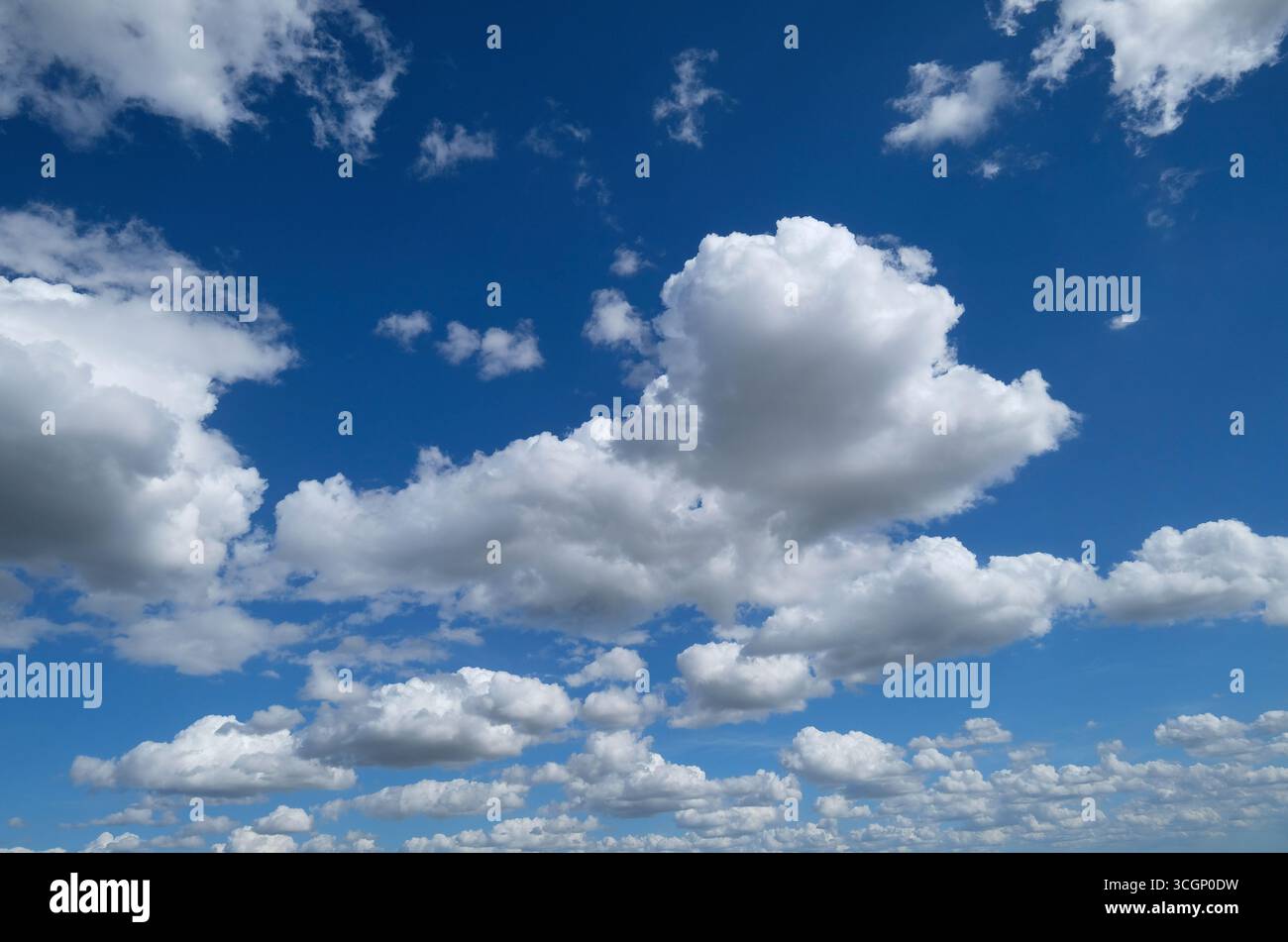 white clouds on bright blue sky, norfolk, england Stock Photo