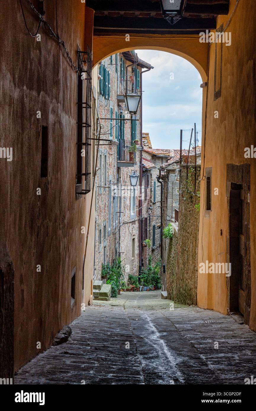 Cortona, Italy - July 6, 2025: Street in the old medieval town of Cortona Stock Photo