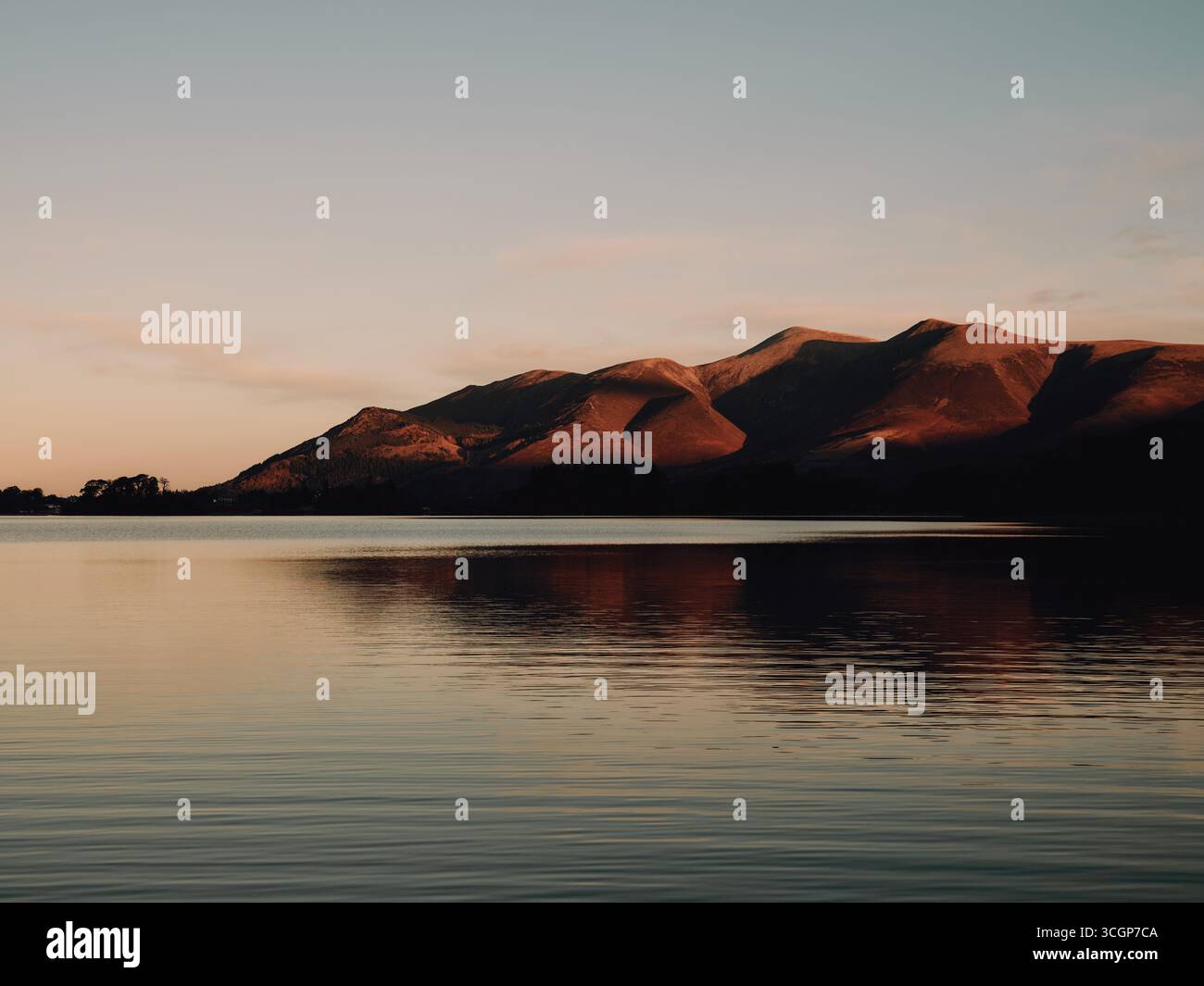 Skiddaw mountain massif at sunrise over Derwentwater in the Lake District National Park,, Keswick Cumbria England UK - landscape tranquil still winter Stock Photo