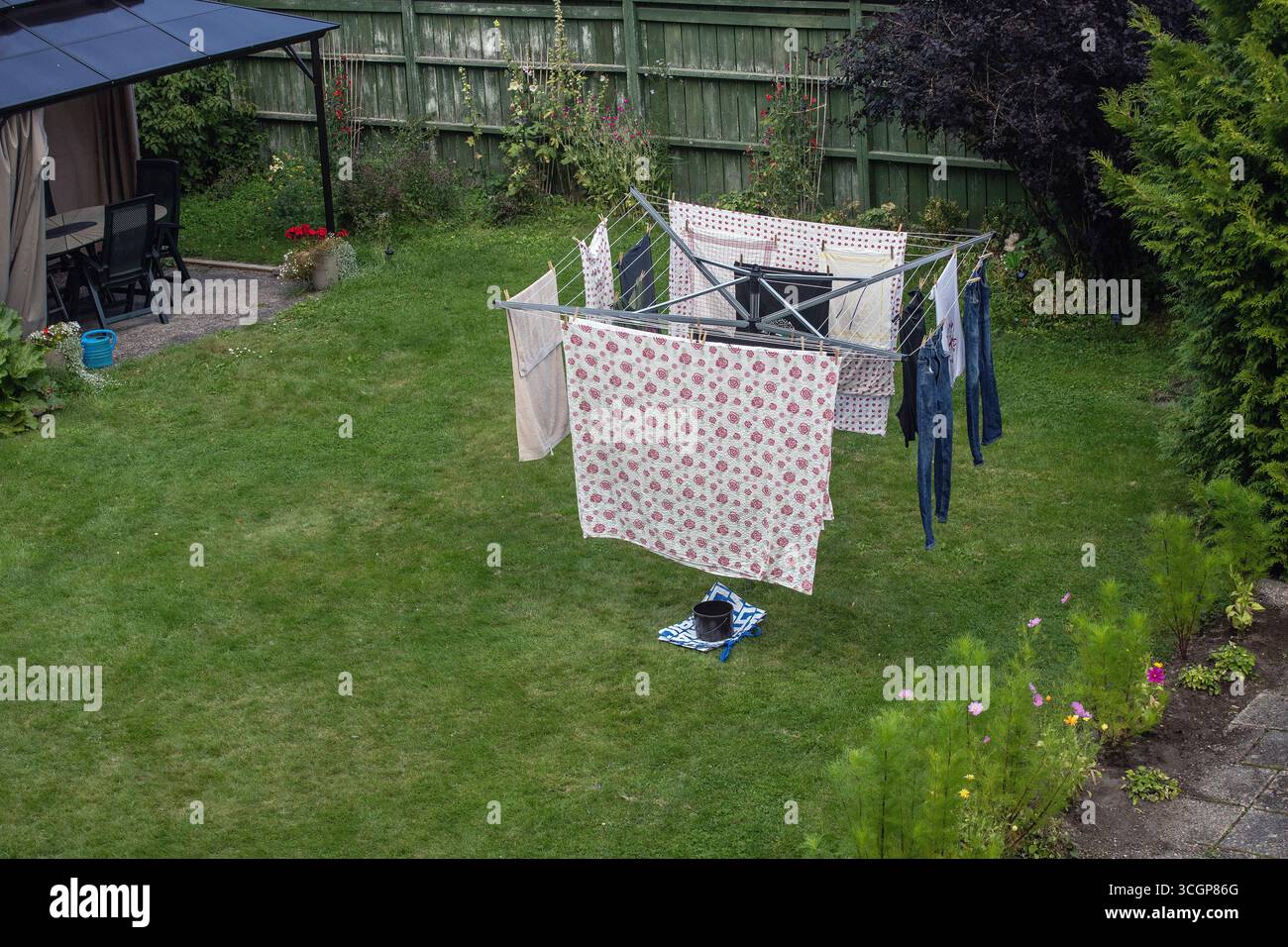 clothes drying rack with laundry in the garden Stock Photo