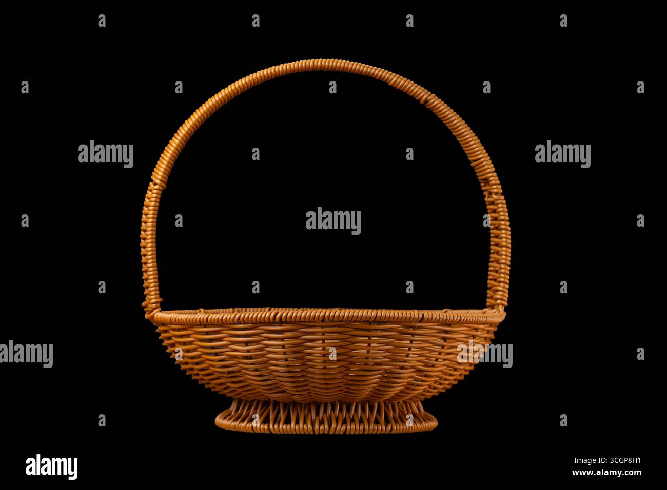 wicker rattan basket on black background Stock Photo