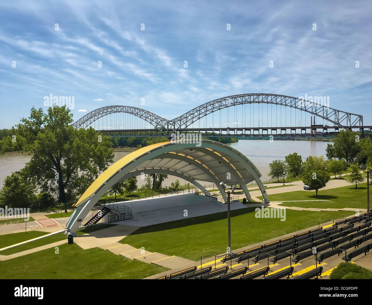 An amphitheater by a riverbank with a view of a bridge Stock Photo - Alamy