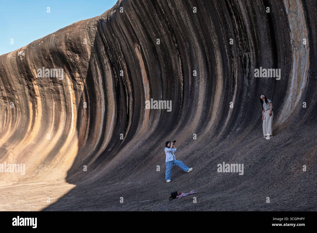 Tourists at Wave Rock, Hyden, Western Australia Stock Photo
