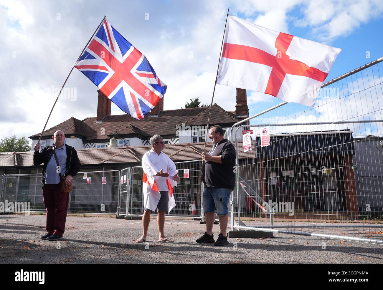 Protesters outside the Bell Hotel after a temporary injunction that would have blocked asylum seekers from being housed at the hotel in Epping, Essex, was overturned at the Court of Appeal. Picture date: Friday August 29, 2025. Stock Photo