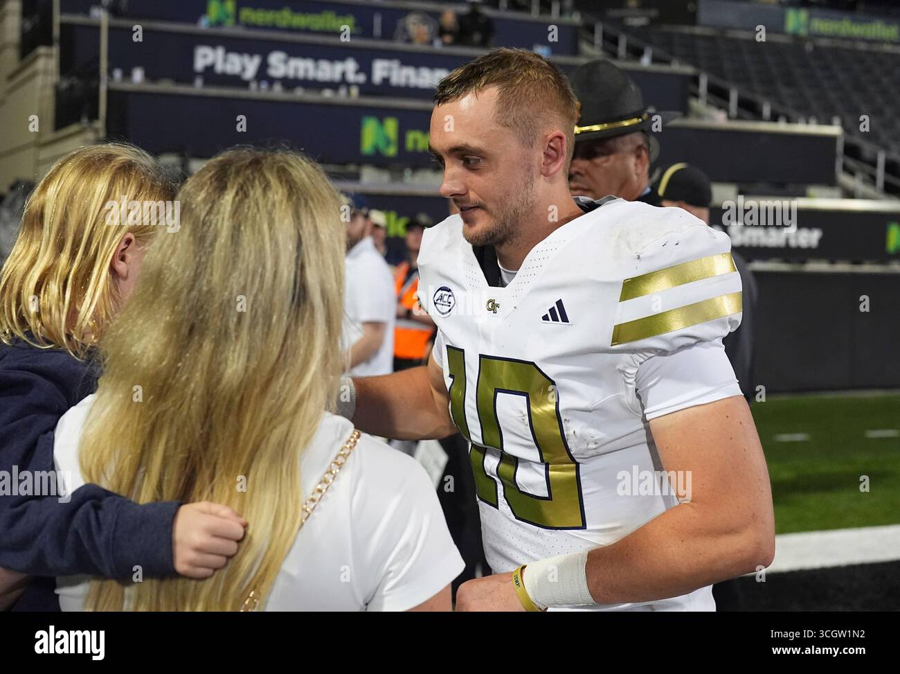Tech quarterback Haynes King, right, greets his family after