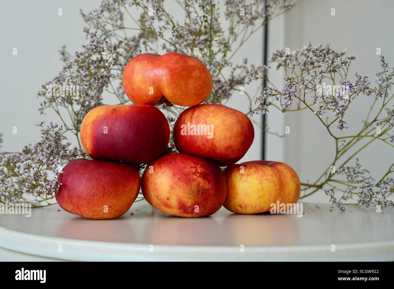 Ripe nectarines on a table in a rustic style Stock Photo
