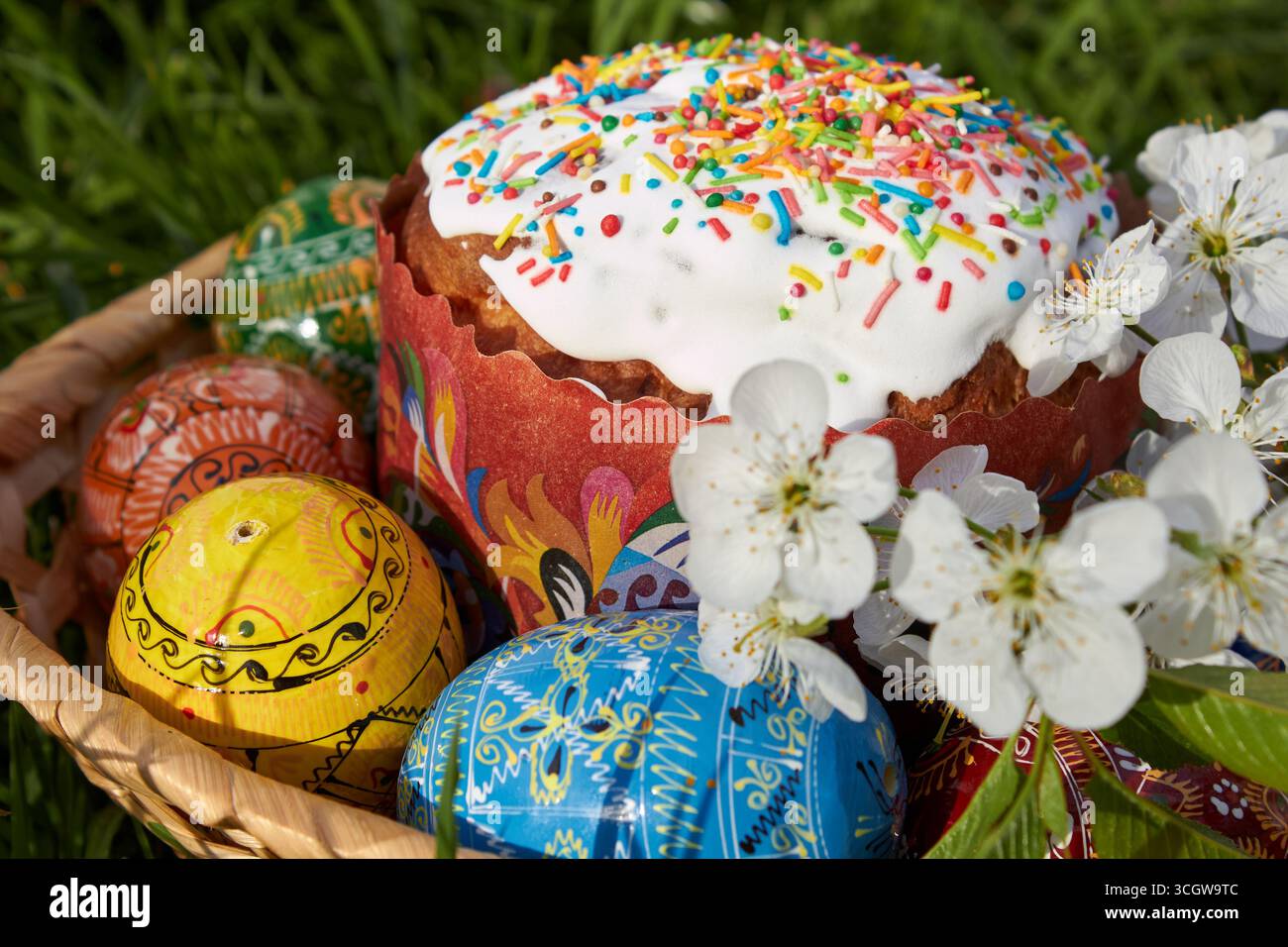 Easter egg with icing on the grass for Easter and eggs painted Stock Photo