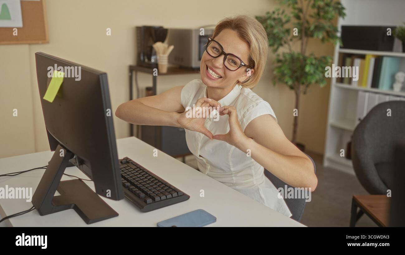 Woman blonde typing makes heart hi-res stock photography and images - Alamy