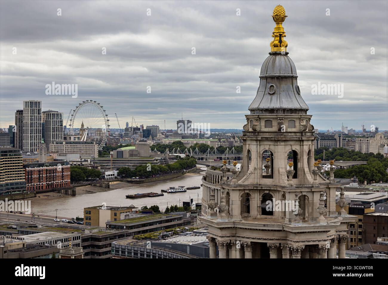 Panoramic view of central London with the River Thames, the London Eye on the skyline, and the dome of St Paul’s Cathedral. Stock Photo