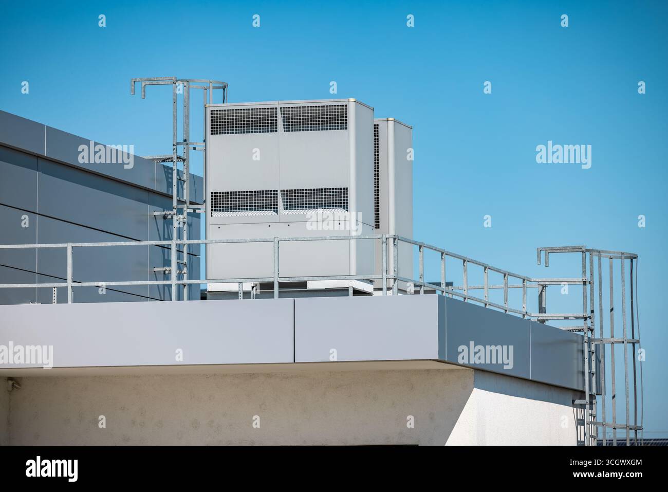 Industrial heating pump with air conditioning installed on a roof of industrial building Stock Photo