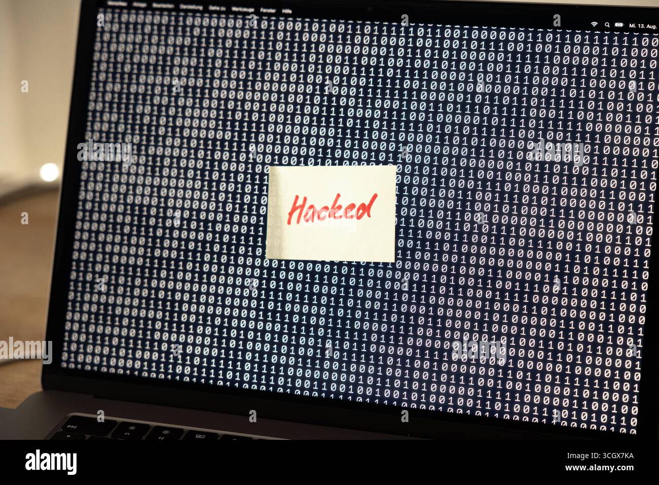 Computer hacked, note on the screen of a laptop, warning sign. Computer error, note on the screen of a laptop, warning sign. Defect, malfunction, error, interruption, binary code, failure, noise, break down, computer bug, interference, device screen. technology_computer_hacked_B97A8638 Stock Photo