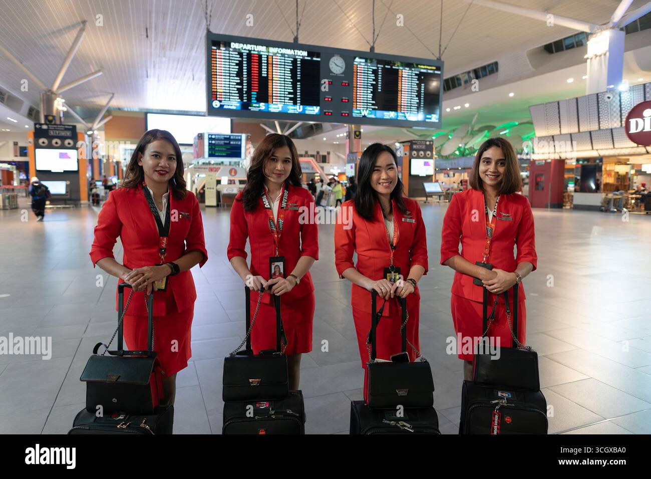 Sepang, Malaysia - August 25, 2024: four AirAsia flight attendants in ...