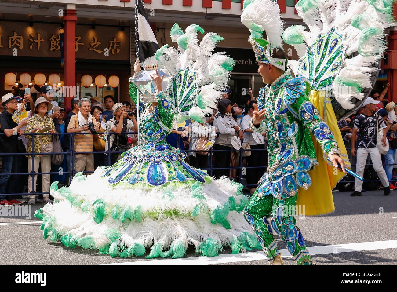 Samba dancers perform through the streets of the traditional Asakusa ...