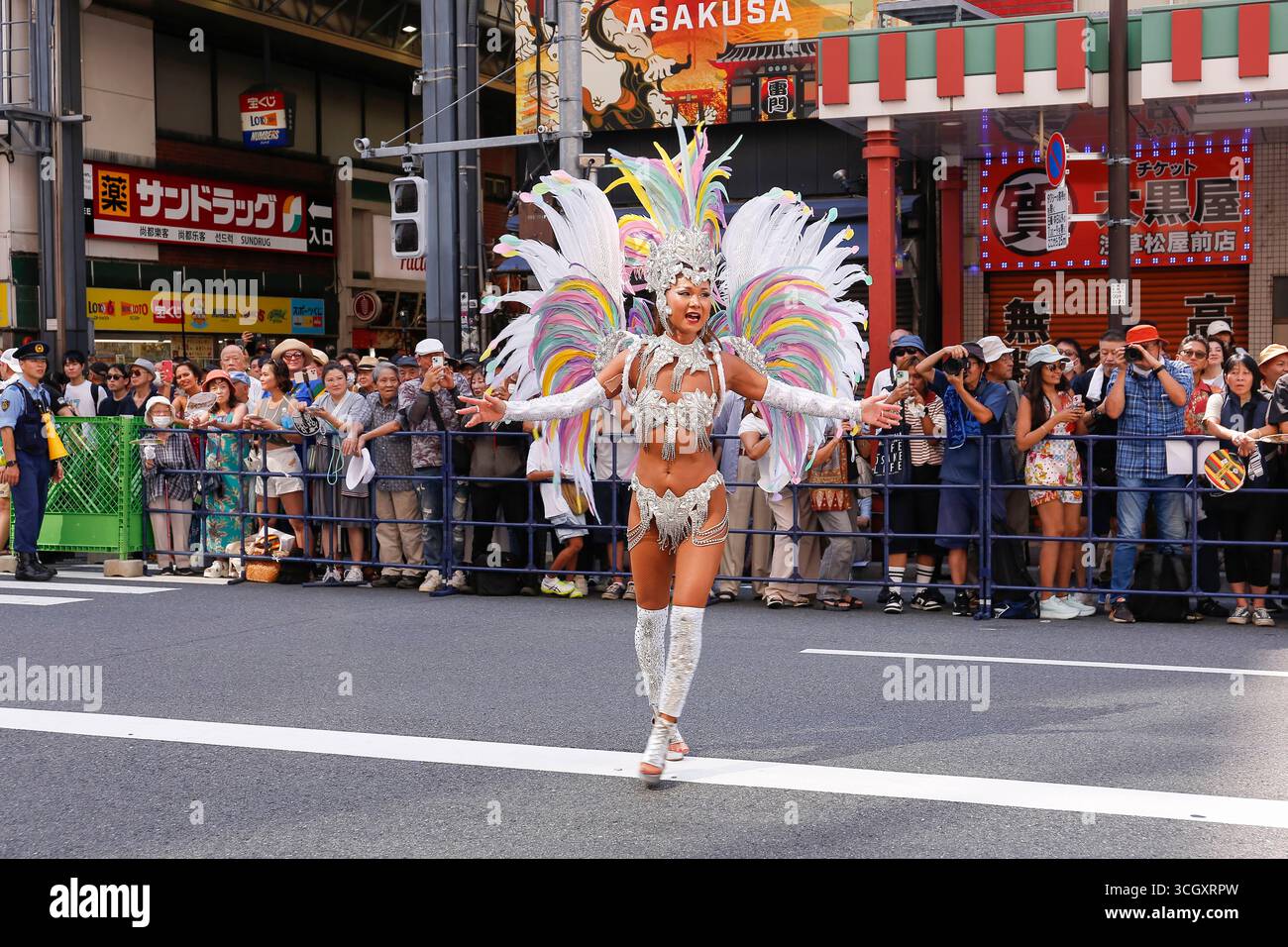 A samba dancer performs through the streets of the traditional Asakusa ...