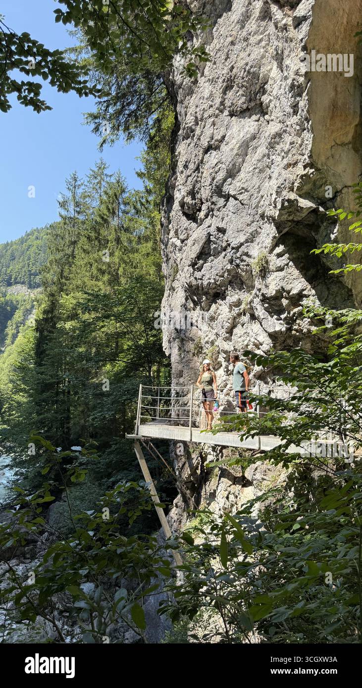 Two hikers stand edge cliff hi-res stock photography and images - Alamy