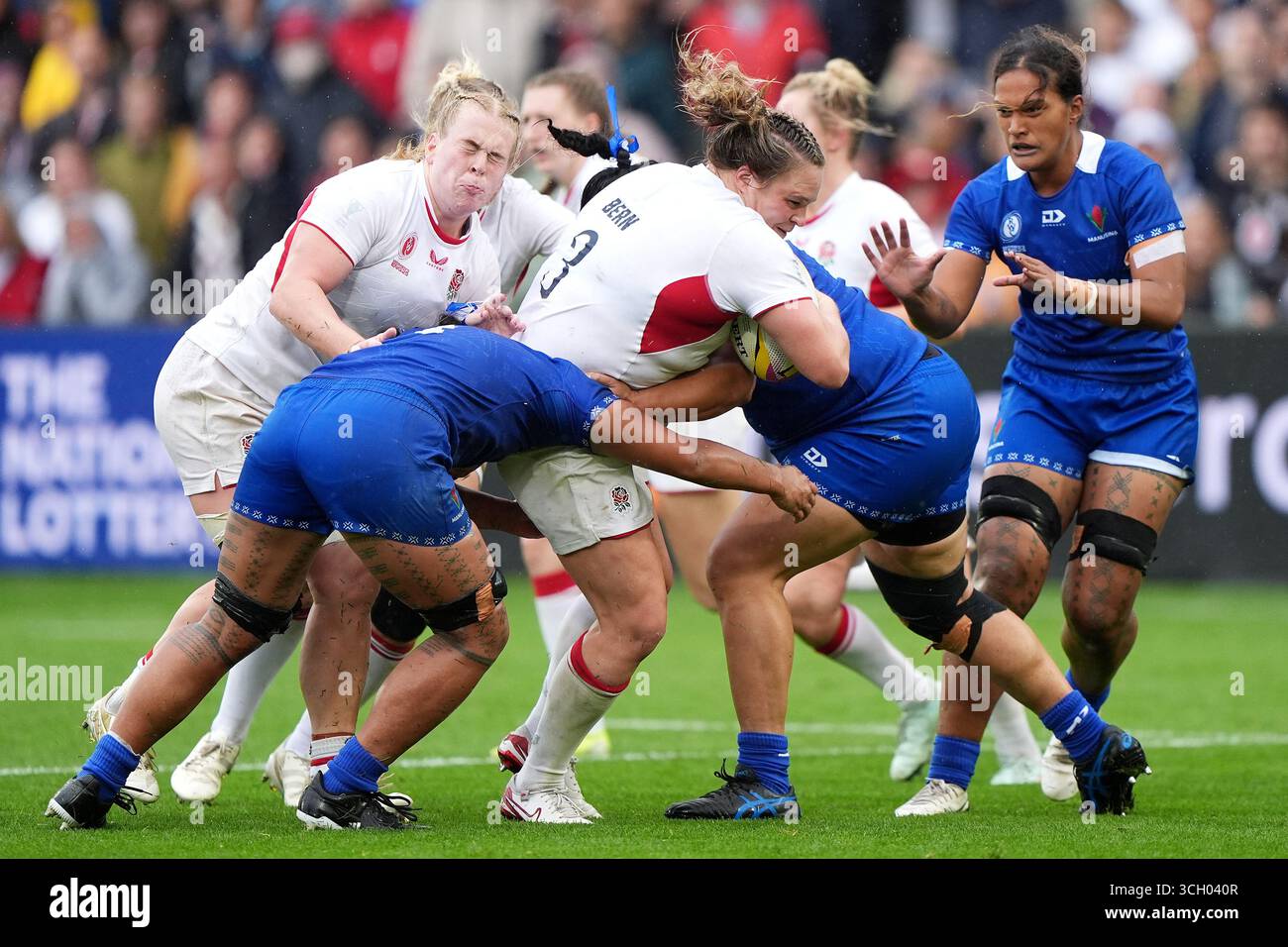 England's Sarah Bern (centre) is tackled by Samoa's Christabelle ...