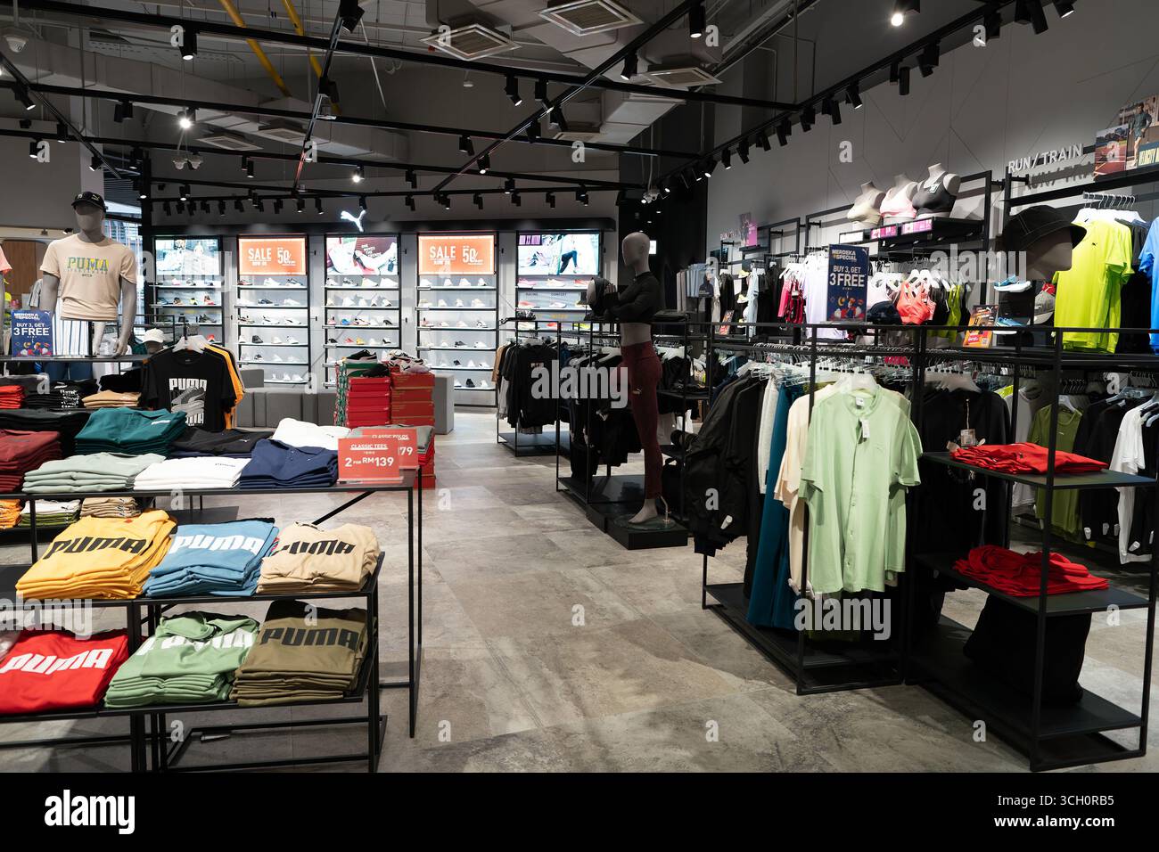 Puma shop interior sneakers display hi-res stock photography and