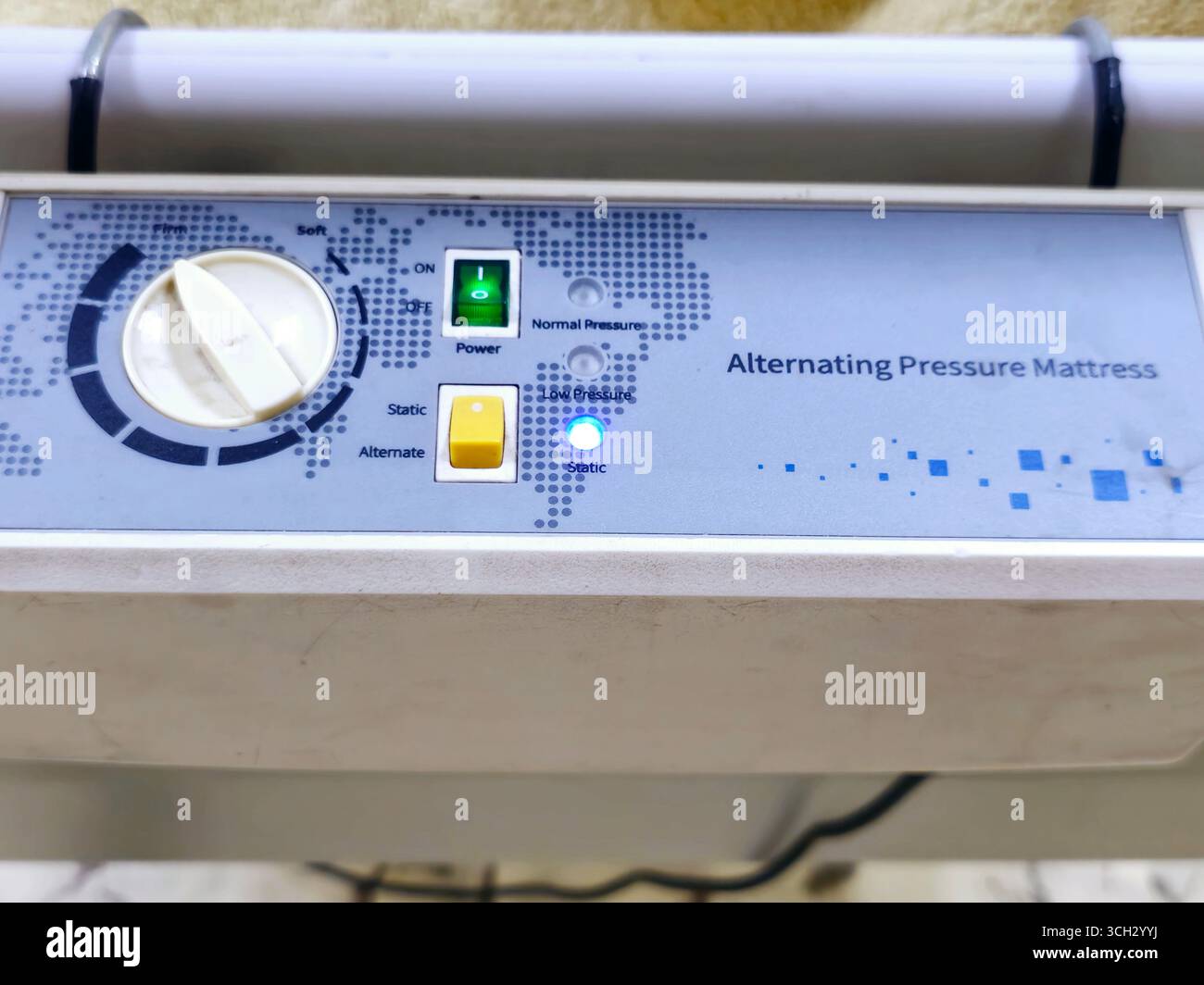 The control unit of alternating pressure mattress, assembled with a row of lateral air cells that constantly alternate, controlled via a pump unit, fo Stock Photo