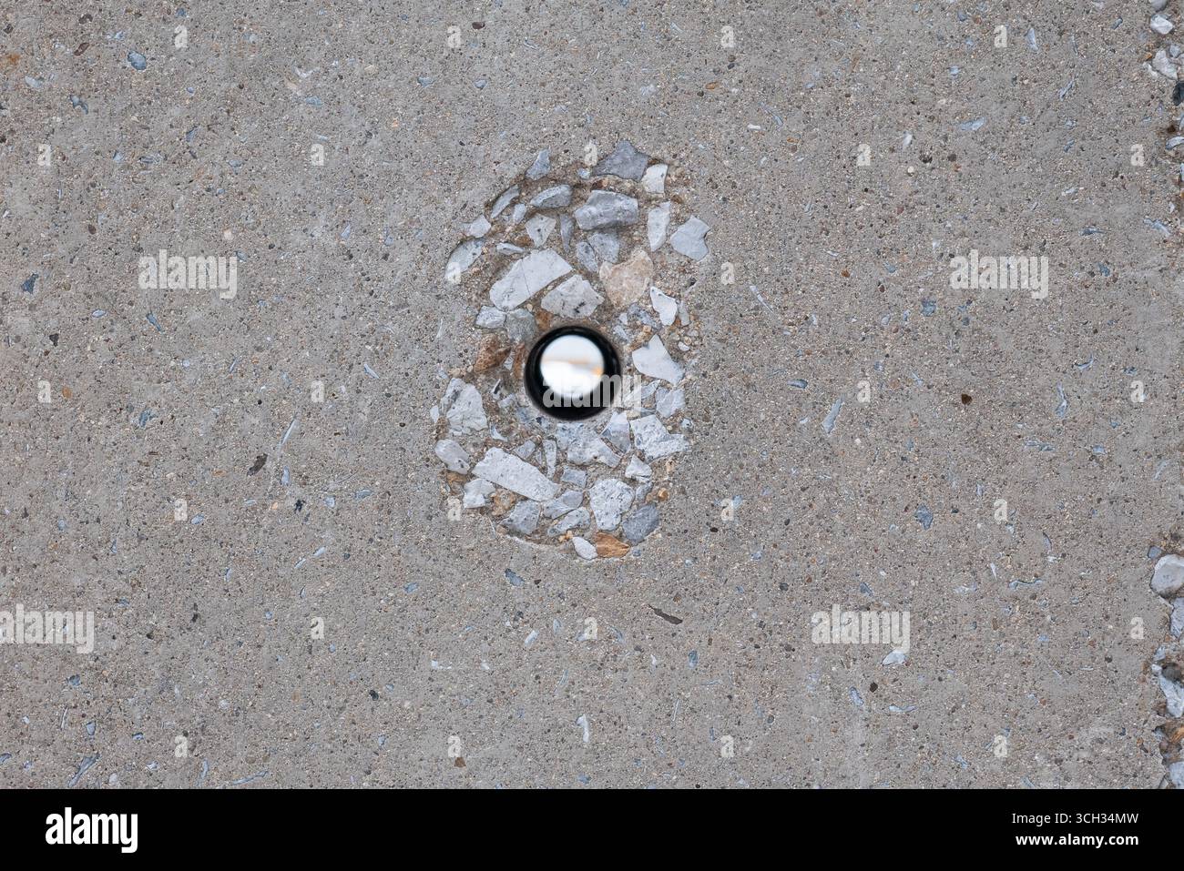 A hole in a concrete electrical pole Stock Photo