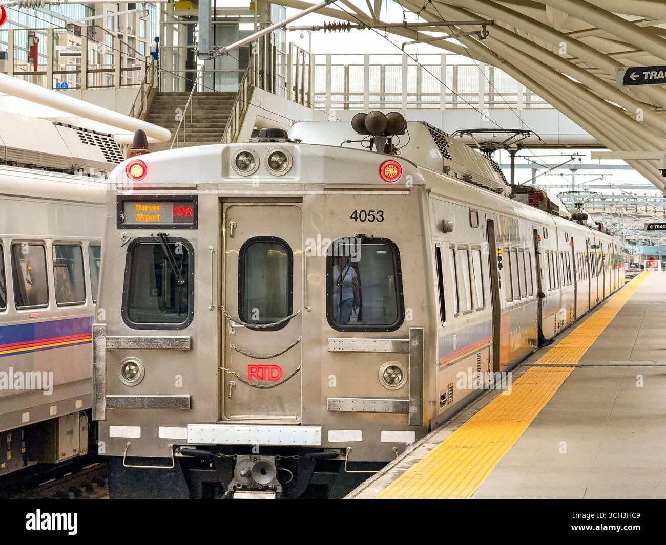 Denver, Colorado, USA - 2 June 2025: Commuter train at a platform in Denver Union Station - Smartphone Captured Stock Image