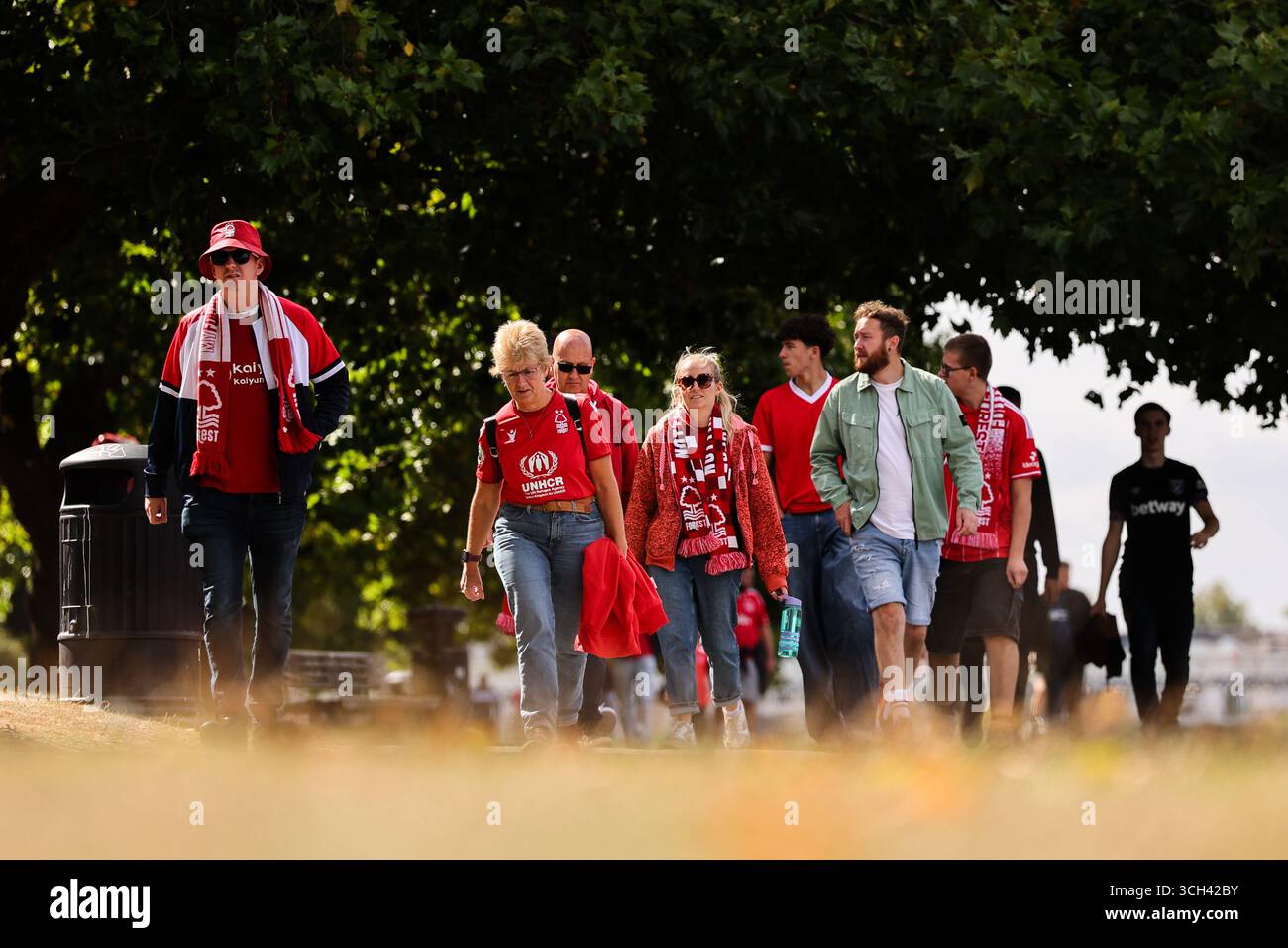 Nottingham, UK. 31st Aug, 2025. Nottingham Forest fans make their way to the City Ground ahead of the Nottingham Forest vs West Ham United Premier League match at the City Ground, Nottingham. Picture credit should read: James Baylis/Sportimage Credit: Sportimage Ltd/Alamy Live News Stock Photo