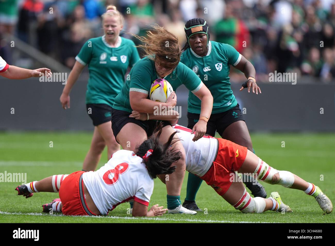 Ireland's Ellena Perry is tackled by Spain's Valentina Perez (left) and ...