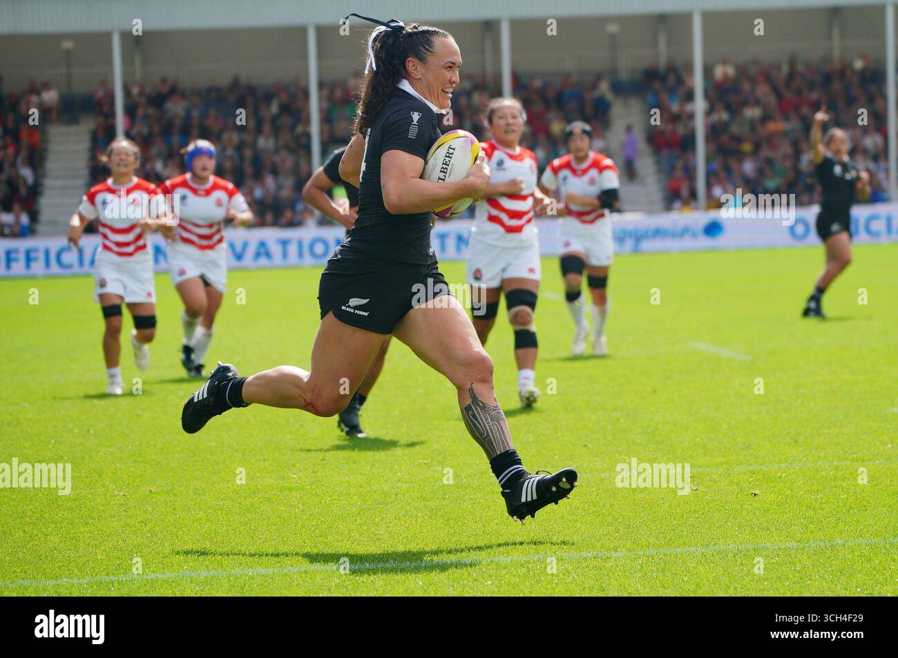 New Zealand's Portia Woodman-Wickliffe runs in to scores her sides ...