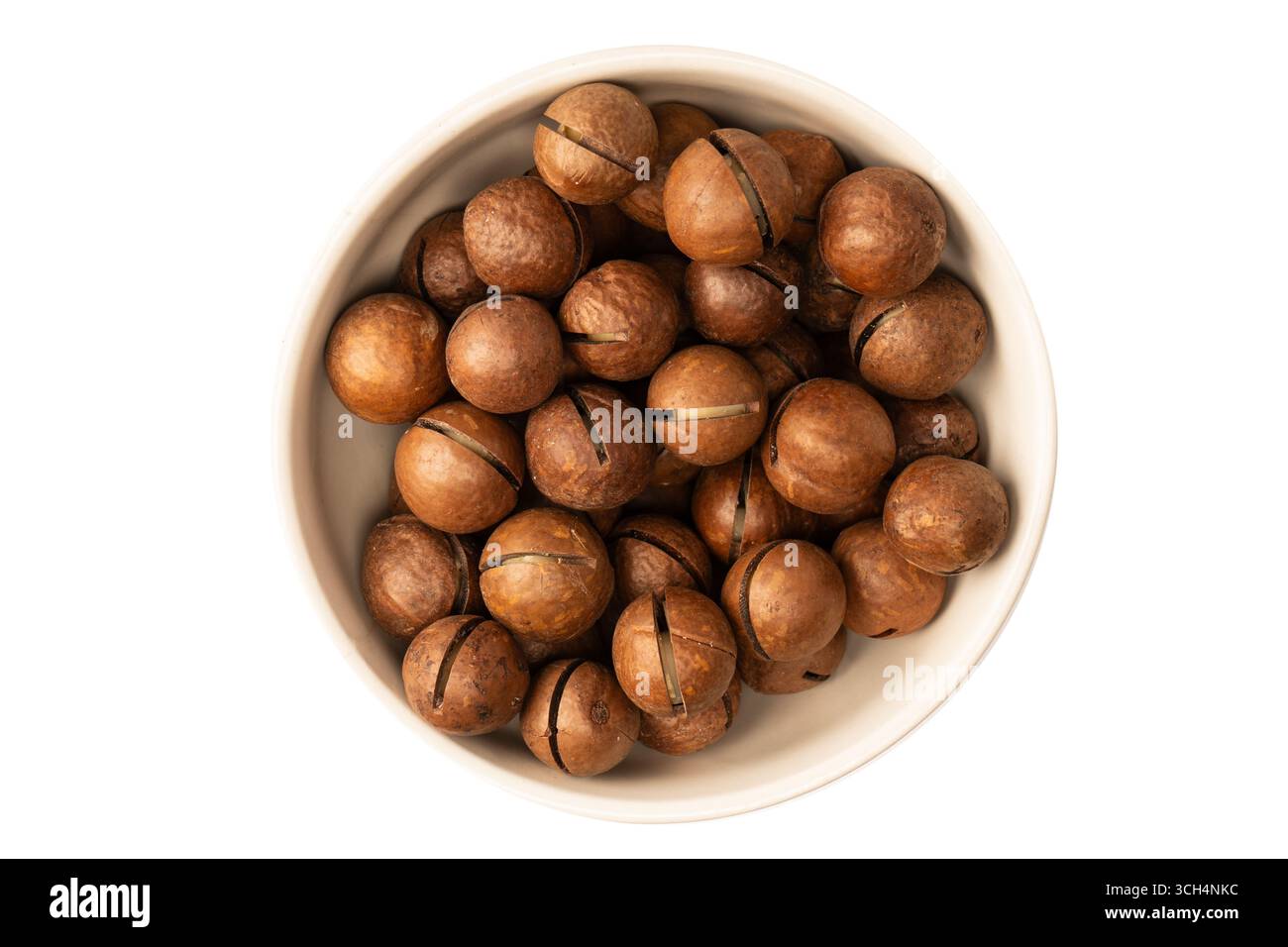 Macadamia nuts in a shell isolated on a white background. Top view. Stock Photo