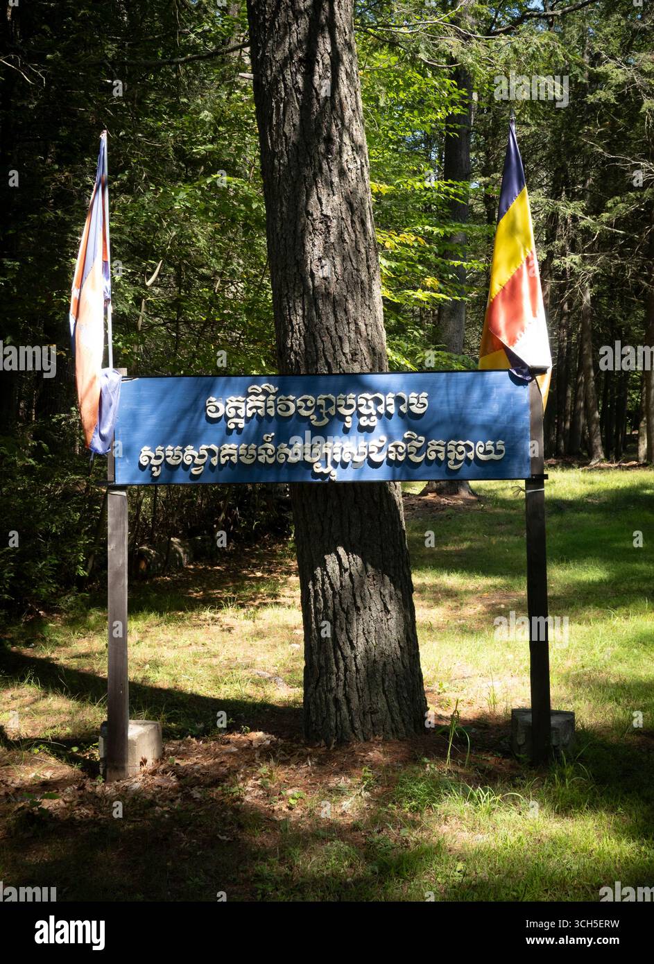 Leverett, MA - US - Aug 23, 2025 A blue entrance sign to Wat Kiryvongsa ...