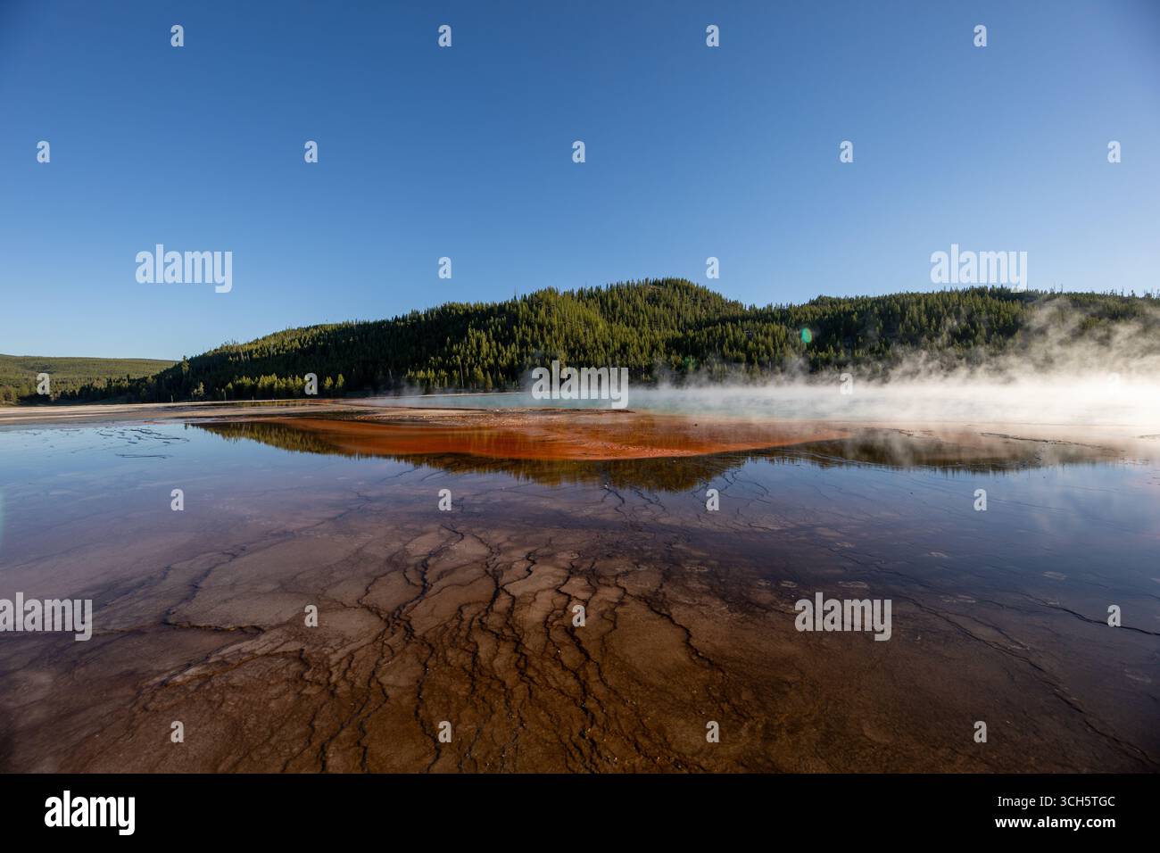A large body of water with a mountain in the background Stock Photo
