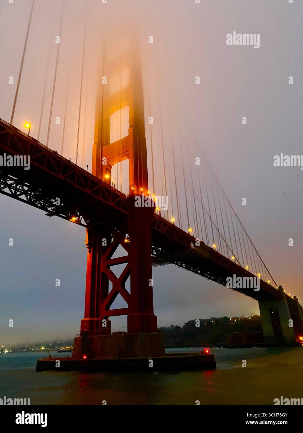Spanning the entrance to San Francisco Bay, the magnificent Golden Gate Bridge stands as a testament to engineering brilliance and aesthetic grandeur. - Smartphone Captured Stock Image