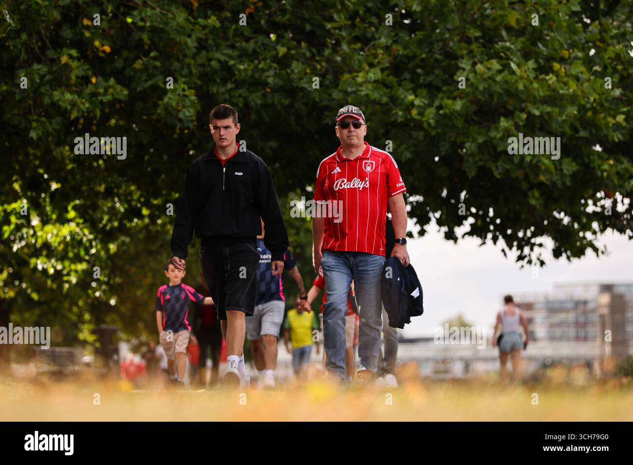Nottingham, UK. 31st Aug, 2025. Nottingham Forest fans make their way to the game before the Nottingham Forest vs West Ham United Premier League match at the City Ground, Nottingham. Picture credit should read: James Baylis/Sportimage Credit: Sportimage Ltd/Alamy Live News Stock Photo