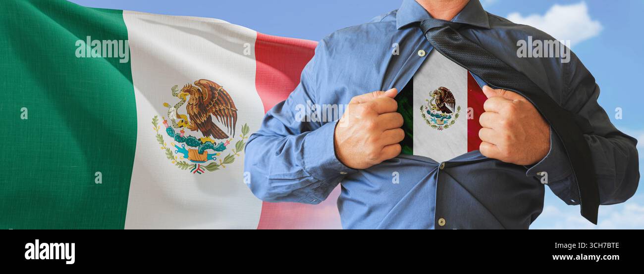 A businessman opening his shirt like super hero with Mexico flag and shows how patriotic he is by revealing his countries flag beneath printed on a t- Stock Photo