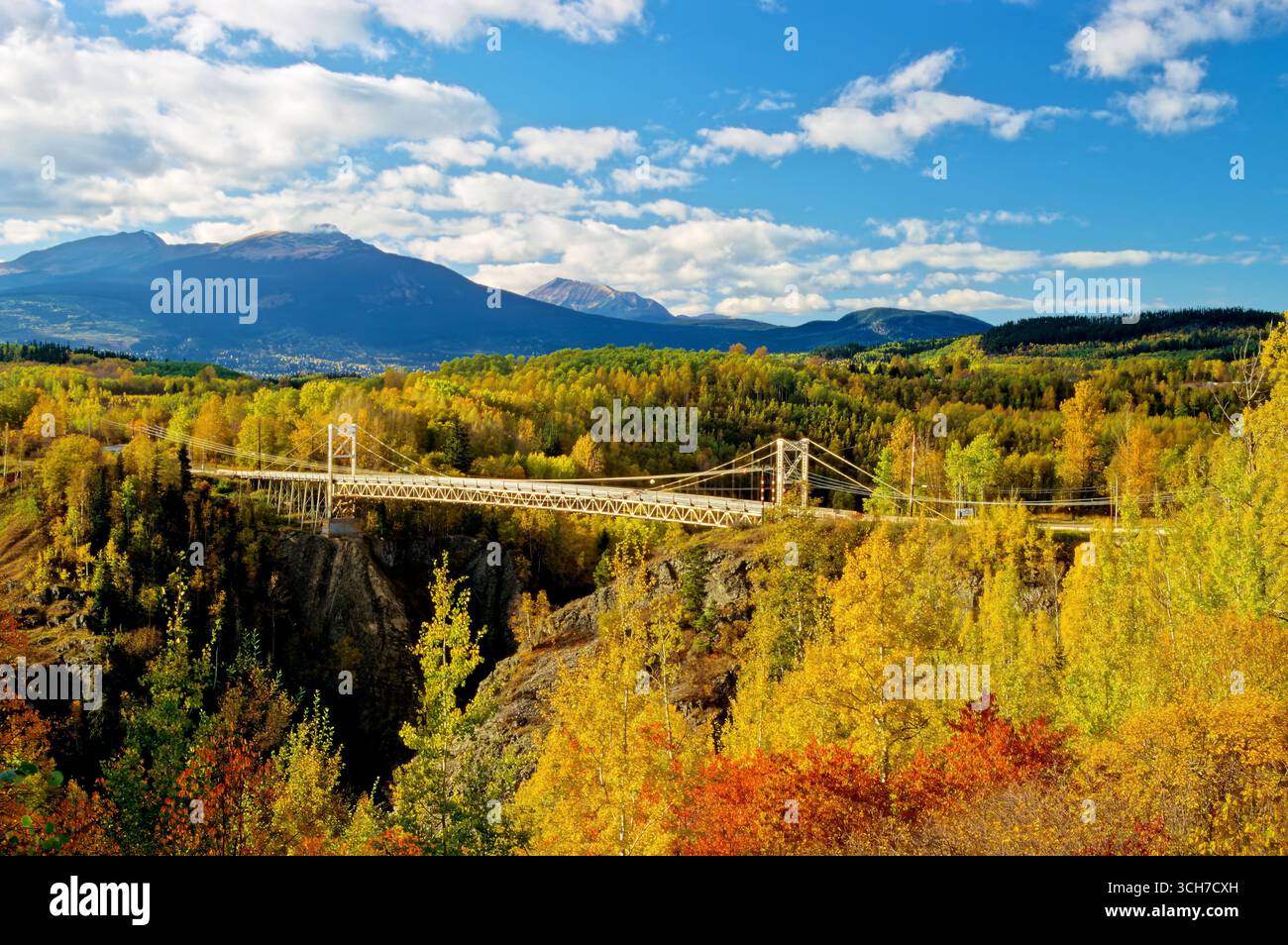 An autumn landscape image of the suspension bridge crossing the Bulkley river over Hagwilget canyon, in British Columbia Canada Stock Photo