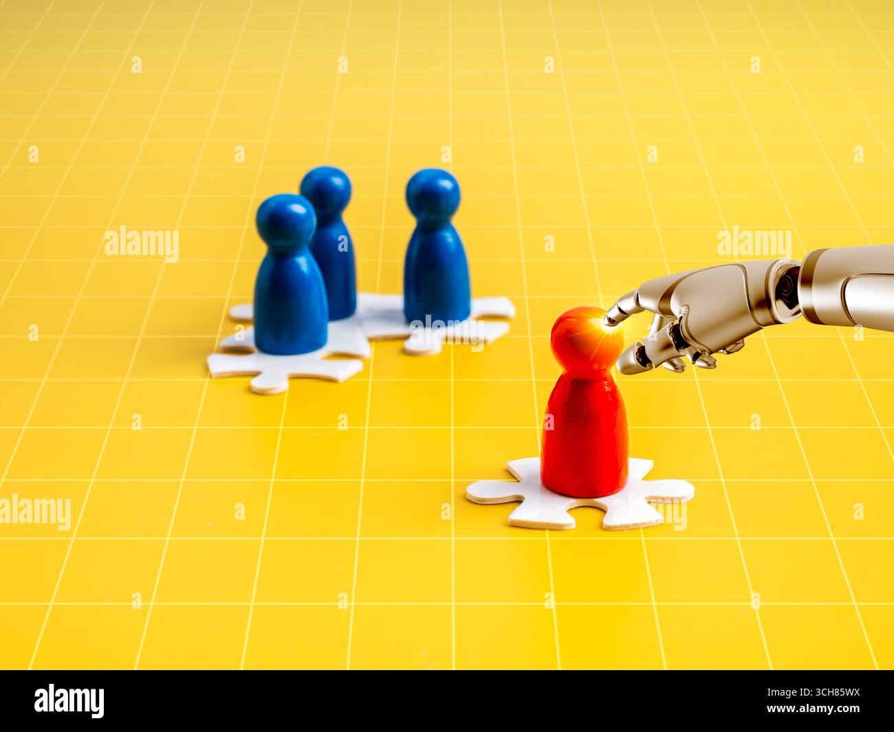Robot hand selecting red human figure among blue ones on puzzle base over yellow grid background, symbolizing AI recruitment, talent selection, HR aut Stock Photo
